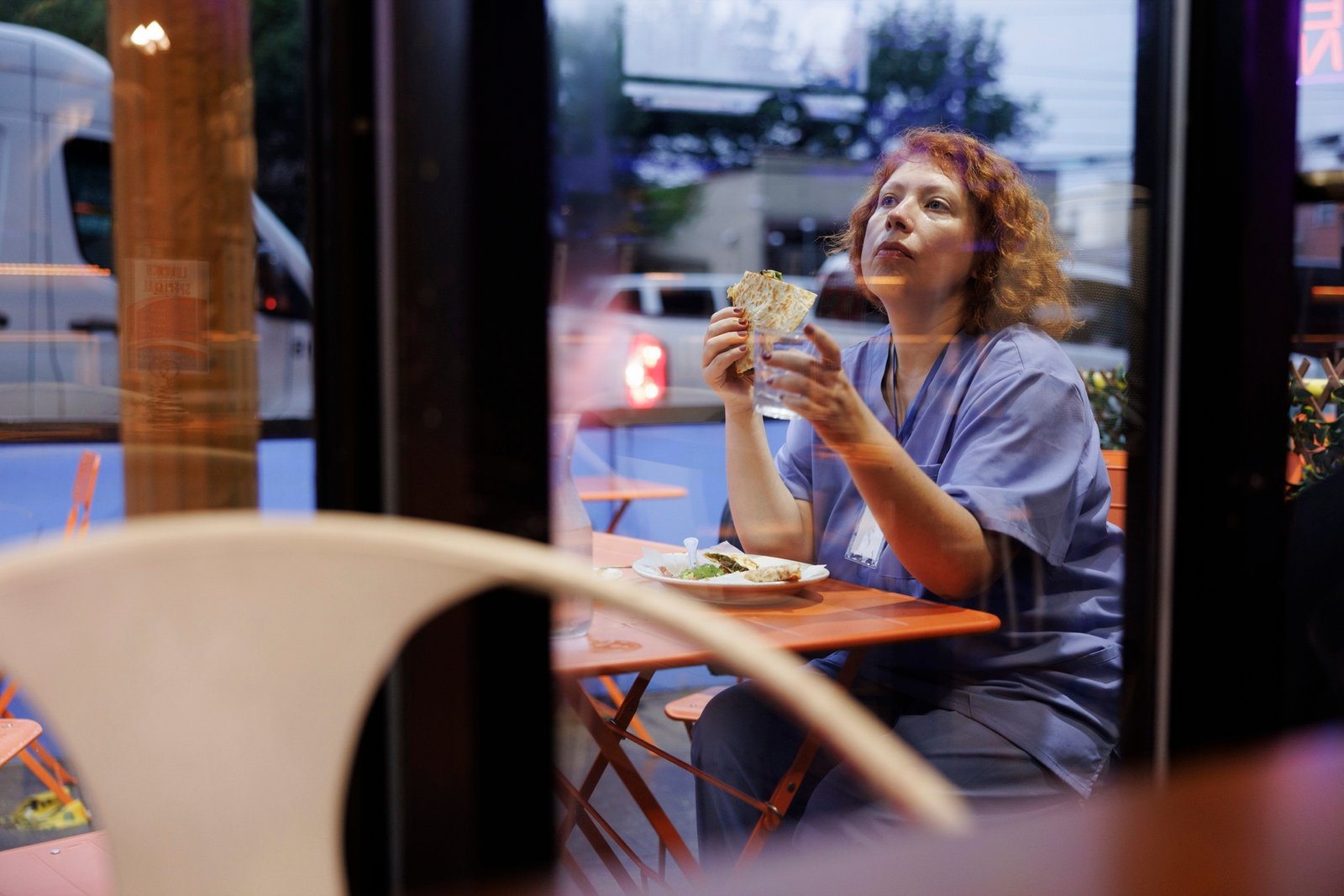 A worker taking a break at a table outside